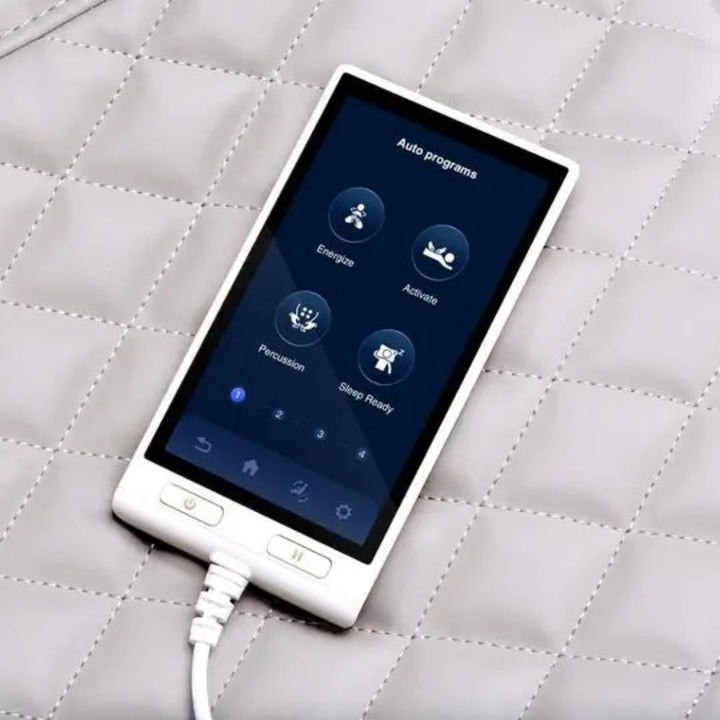 White electronic device with a blue screen on a quilted gray surface