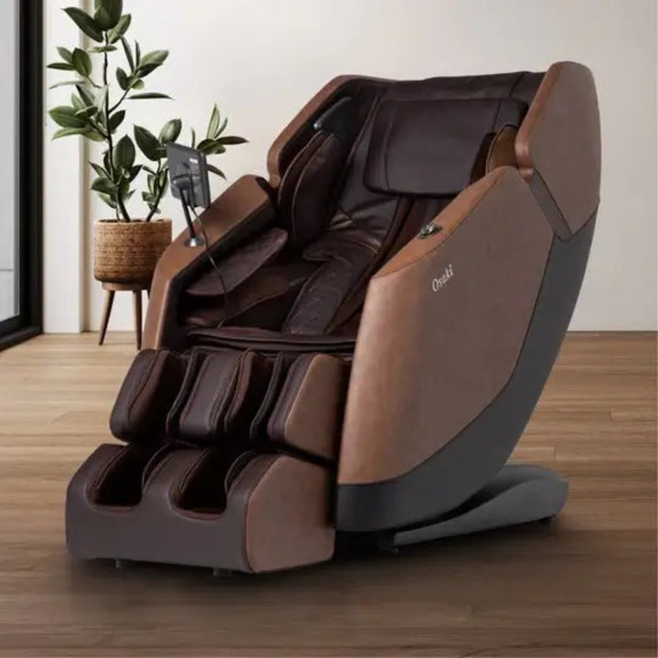 Brown massage chair in a room with a plant on a wooden floor