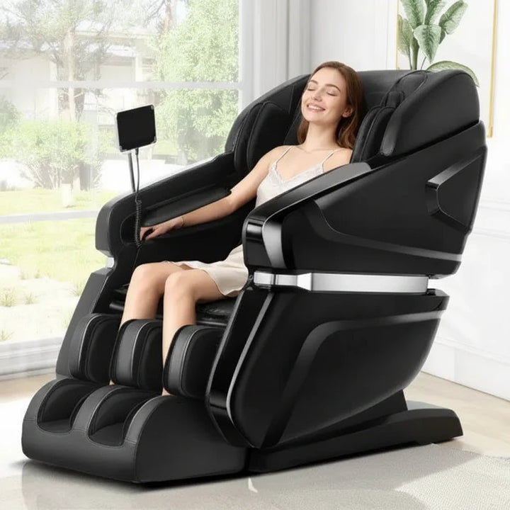 A woman reclines in a black modern massage chair in a bright room, and red gift boxes with red roses appear in the lower right corner.